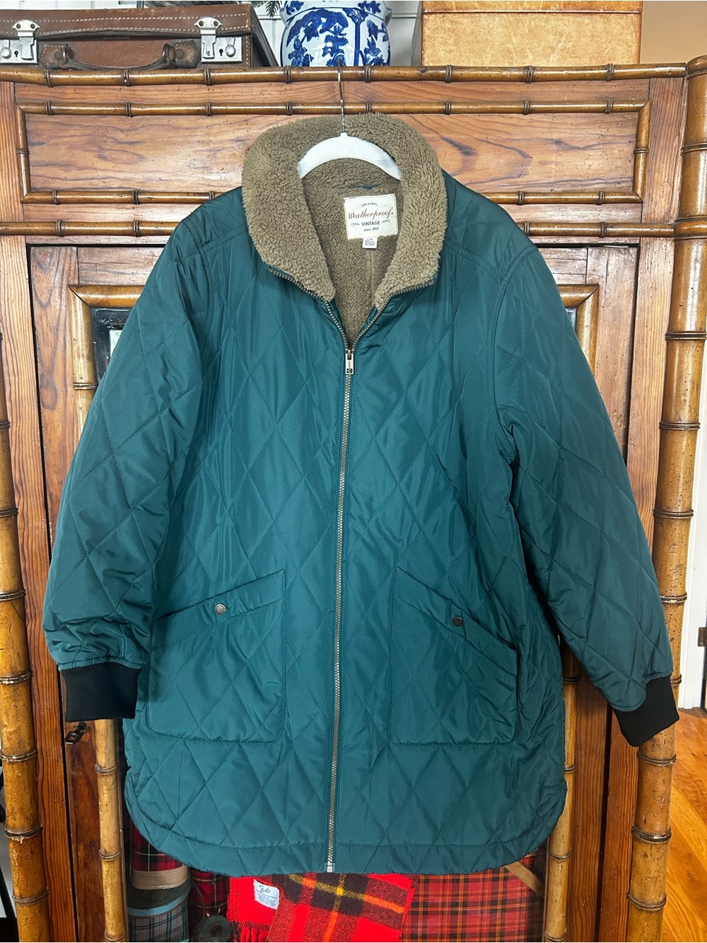 Weatherproof green jacket with tan sherpa lining